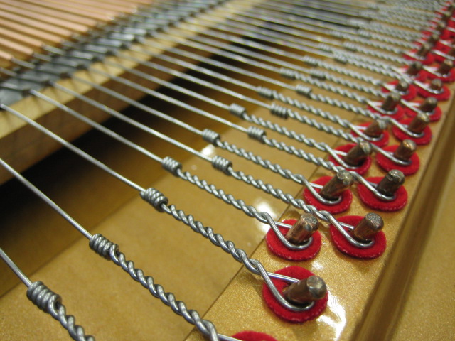 Buzzing Bass Strings in a Piano — Fine Tuning
